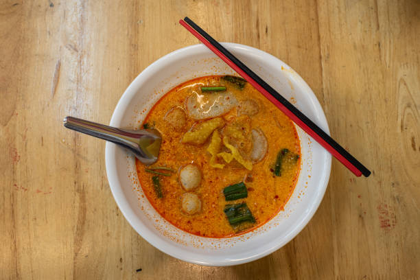 istock Tom Yum Noodle on white noodle cup use spoon and chopstick to eat 1453773501