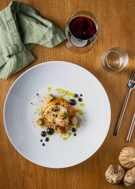 istock Delicious dish with fish, vegetables, and special sauce 1453775235