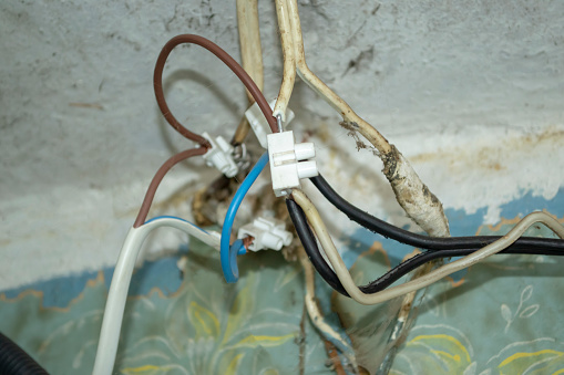 Connecting elements for wiring. Tangled wiring in the house. Repair of electrical wiring in the apartment.