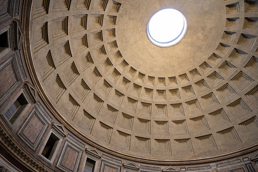 Architectural detail of the ceiling of the coffered dome of the Pantheon. The Pantheon ('to every god') in the Piazza della Rotonda in Rome, Italy was built by Marcus Agrippa in 27 BC and rebuilt by Emperor Hadrian in about 126 AD. The concrete for the coffered dome was poured in moulds, probably mounted on temporary scaffolding. The oculus (round opening on top of the dome) is the main source of natural light.