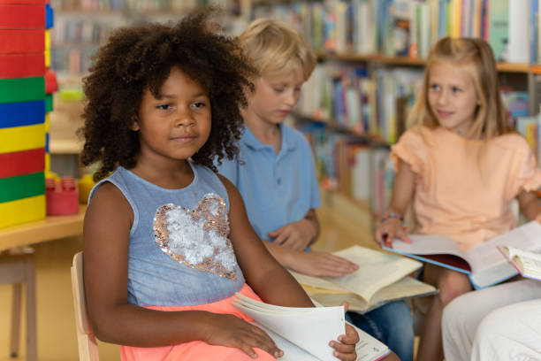 istock Preschoolers in the library 1453778030