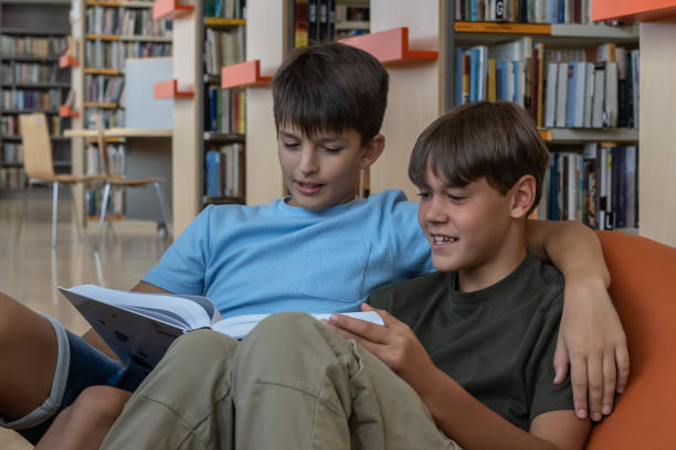 istock Primary school children play in the library 1453778272