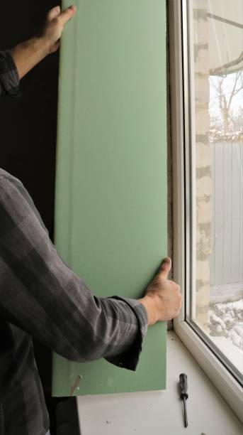 istock forming a window slope in the home room 1453778881