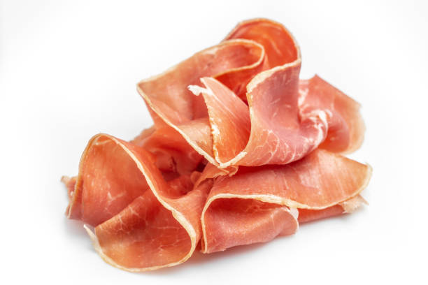 Dry Spanish ham, Jamon Serrano, Iberian ham Isolated on white background. Long banner format stock photo