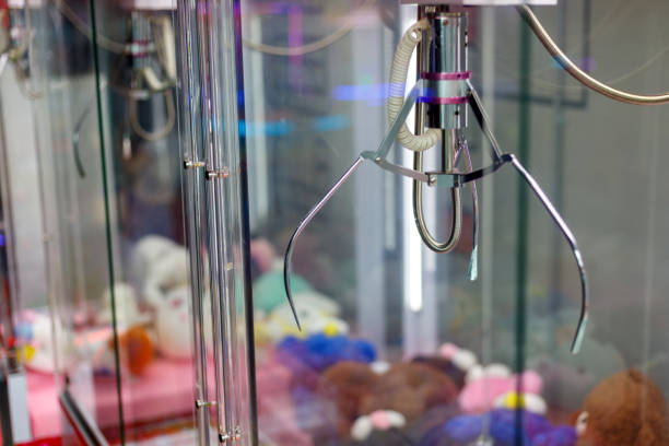 istock A mechanical arm selecting a random soft toy in a vending machine 1453785218