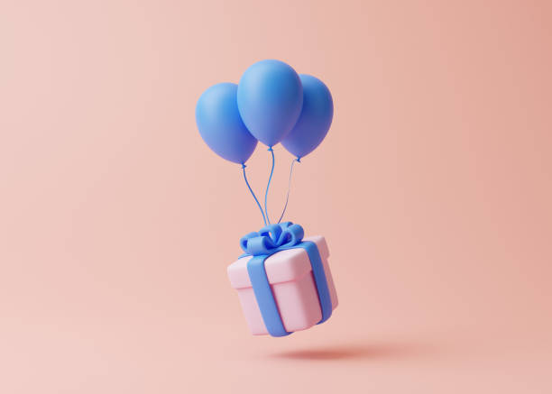 istock Gift box and balloons on pastel pink background 1453786594