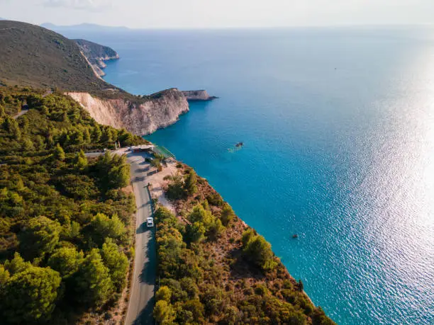 aerial view of car moving by road at Lefkada island Greece near ionian sea