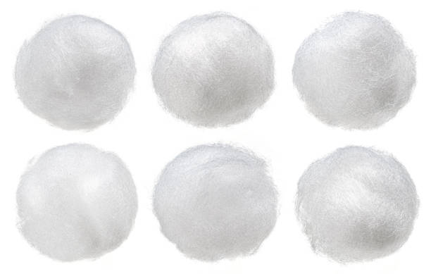 Balls of fluffy cotton wool isolated on white background