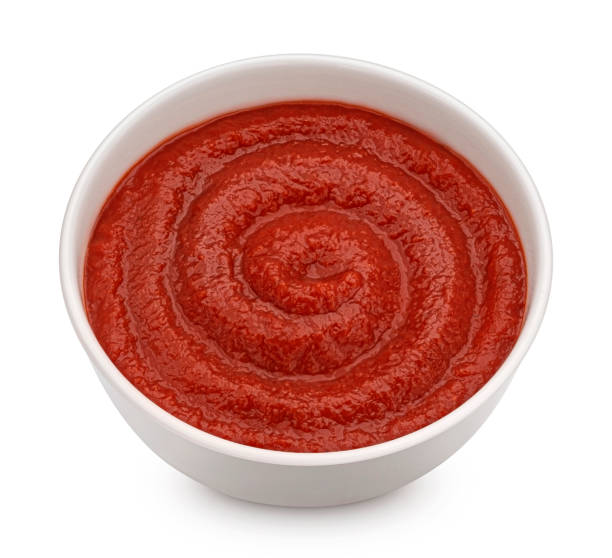 istock Ketchup in bowl isolated on white background, top view 1453788150