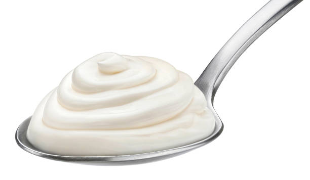 istock Whipped mascarpone cream in spoon isolated on white background 1453788223