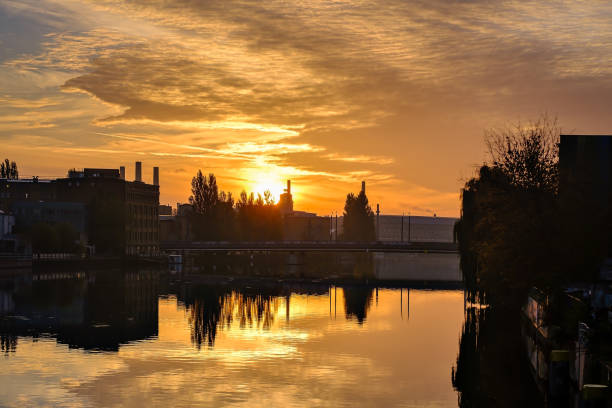 istock Historical industry architecture in morning light: sunrise over river Spree in Berlin-Oberschöneweide 1453788935