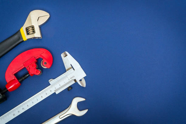 istock Set of tools on blue background prepared by professional master before repair or construction 1453789043
