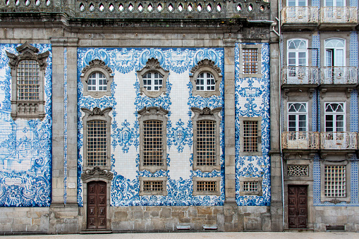 Traditional historic facade in Porto decorated with blue painted tiles, Portugal