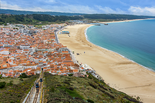 High angle view from Miradouro do Suberco over Nazare with the funicular on the left.