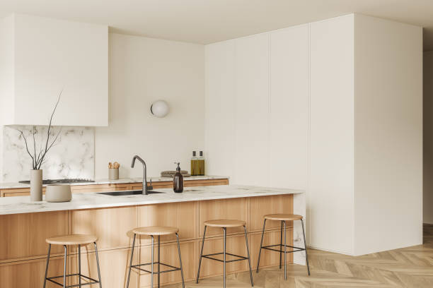 istock Corner view on bright kitchen room interior with island, barstools 1453791882