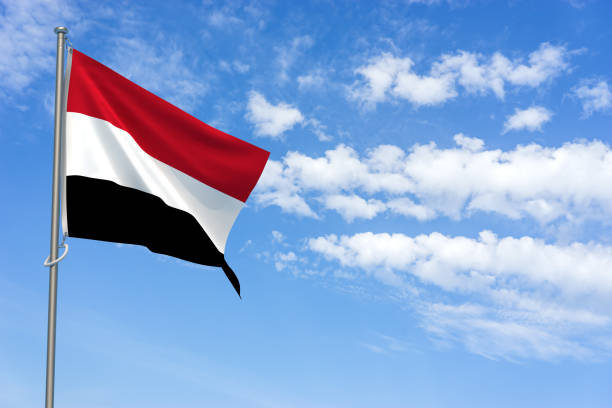Republic of Yemen Flag Over Blue Sky Background. 3D Illustration stock photo