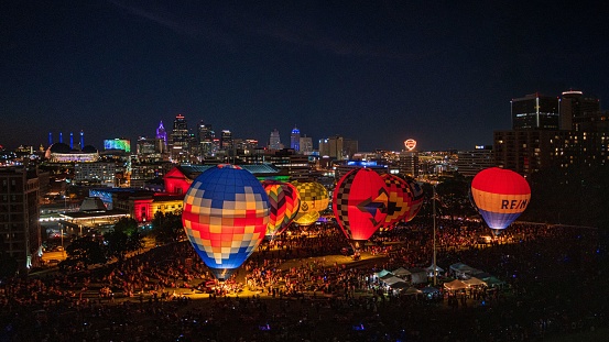 Kansas City, United States – August 20, 2022: An aerial view of huge glowing hot air balloons at the National WWI Museum in Kansas City