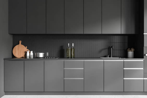 istock Grey kitchen interior with hidden shelves and minimalist kitchenware 1453793219