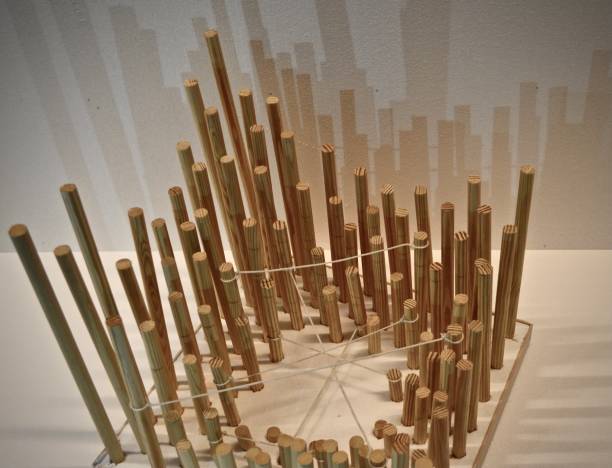 istock Artistic 3d physical architectural model of wood cylindrical sticks at design studio 1453793226