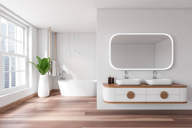 istock Stylish bathroom interior with tub and double sink, panoramic window 1453794377