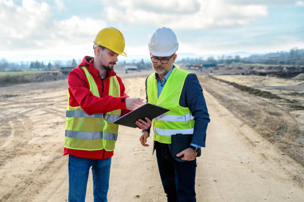 istock Engineer and investor on a road construction site 1453794857