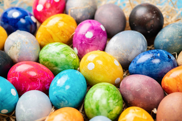 Different easter eggs on straw on stock photo