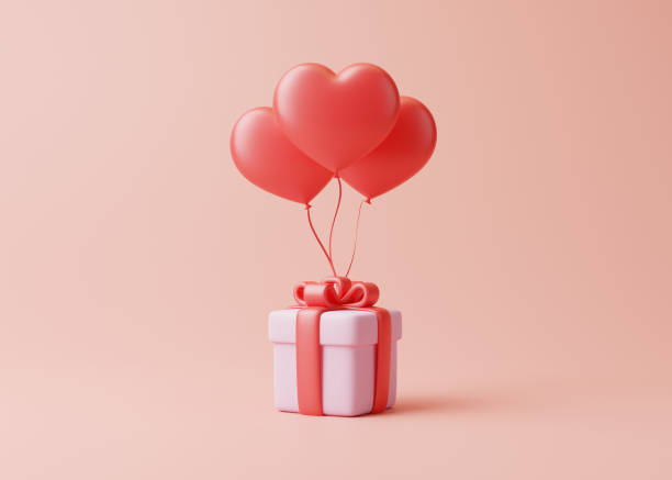 istock Gift box and heart shaped balloons on a pastel pink background 1453798136