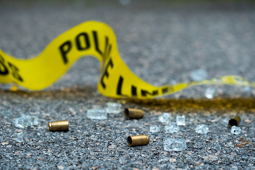 Bullet casing on the floor. Crime scene investigation.