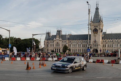 Iasi, Romania – September 25, 2022: a shot of people and cars at Iasi Rally 2022, during a beautiful autumn