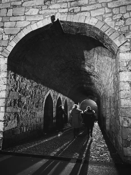 istock People walking through a tunnel in Belgrade by night 1453799357