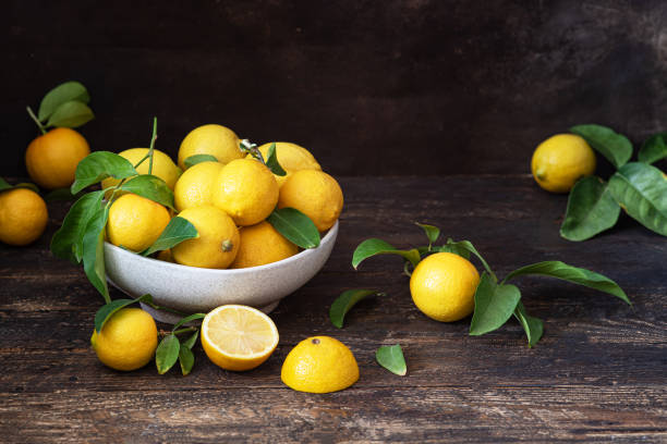 istock Fresh lemons in a bowl on the table 1453799405
