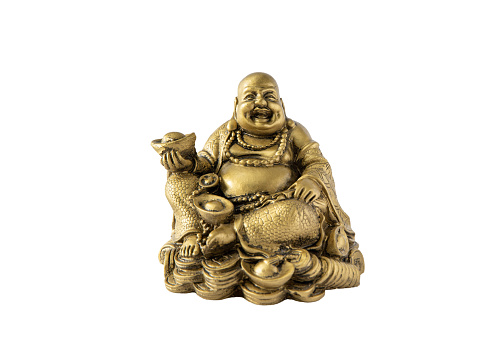 Gold color Feng Shui sitting laughing Buddha with gold coins. Wealth, prosperity, luck charm. Buddha figurine isolated on white background, lot of copy space.