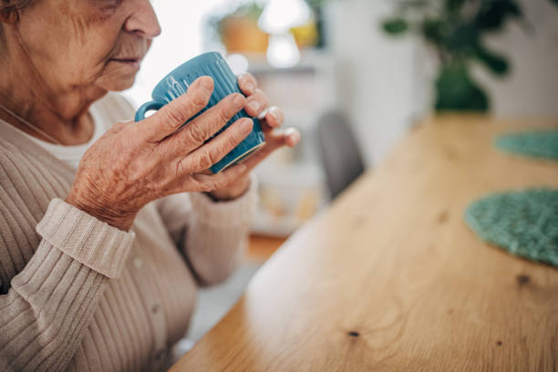 istock Old woman at home 1453799681