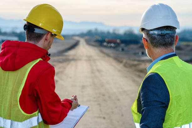 istock Engineer and investor on a road construction site 1453800694
