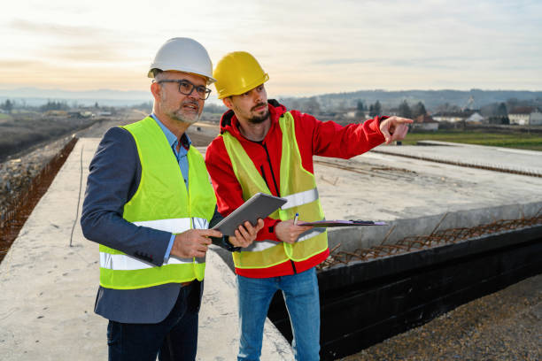 istock Engineer and investor on a road construction site 1453802664