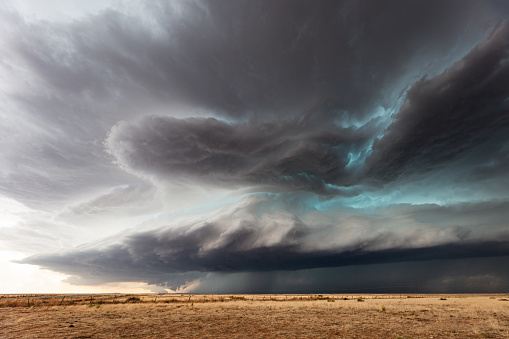 Stormy sky with dark, ominous clouds ahead of a supercell thunderstorm near Fort Sumner, New Mexico.