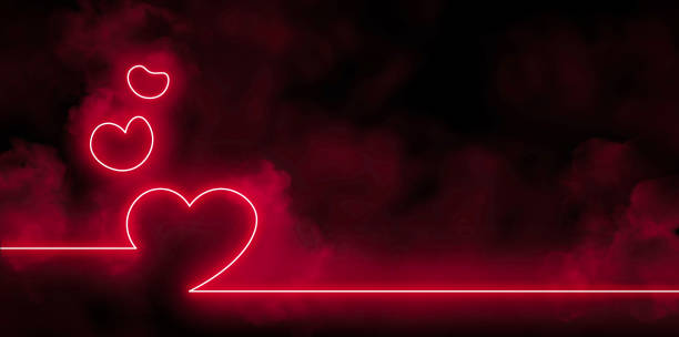 istock Bright pink heart shaped neon lights with smoke in the dark 1453807026