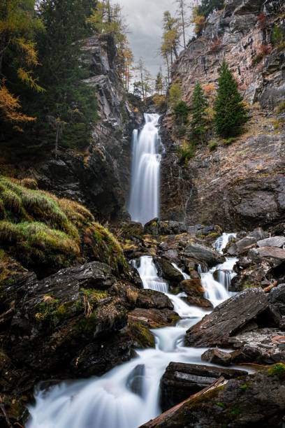 istock Cascate di Saent waterfall flowing through mossy rocks during the daytime in long exposure 1453807330