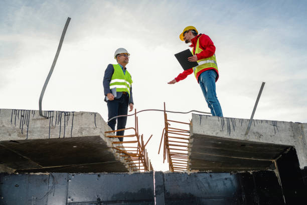 istock Engineer and investor on a road construction site 1453808490