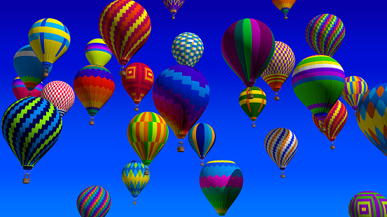 Front view of group of hot air balloons with vivid colors and geometric designs flying on a sunny day with cloudless blue sky. 3d Illustration