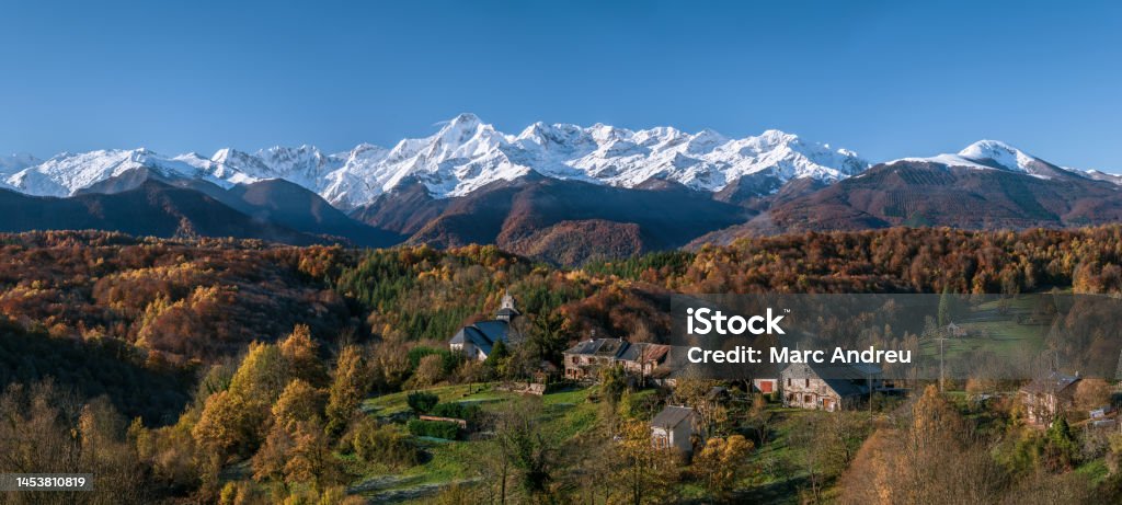 Mountain village in the Ariege Pyrenees in southwest France Mountain village in autumn with first snow on the peaks in the background Ariege Stock Photo