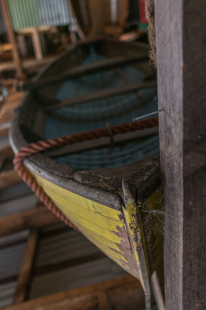 istock Old yellow fishing boat at display 1453812895