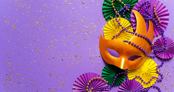 Mardi gras.Holidays mardi gras masquarade, venetian mask  fan over purple background. view  above,mardi gras background copy space Happy Mardi Gras
Fat Tuesday carnival texture golden,green purple