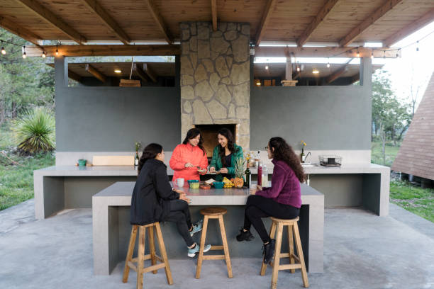istock Young women eating in campsite 1453814490