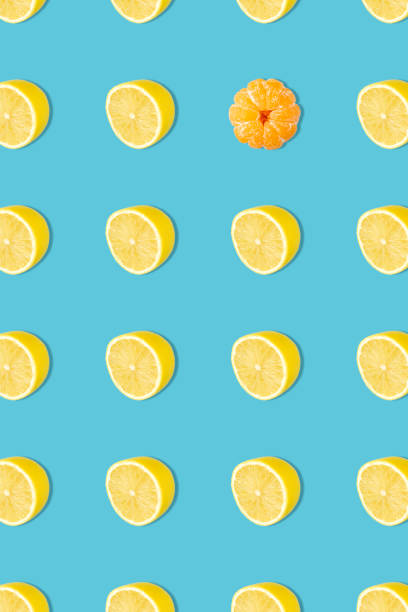istock Creative photos of tangerines on a blue background: 1453815507