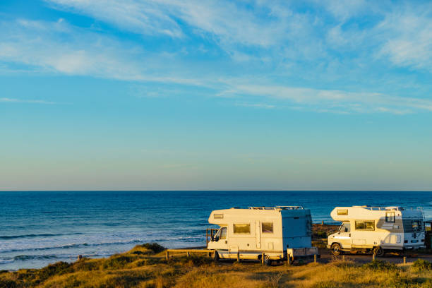 istock Camper rv camping on sea shore, Spain 1453816637