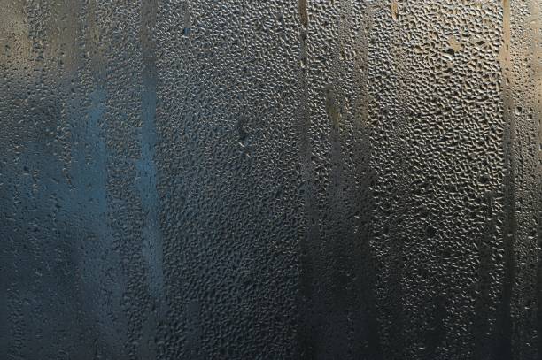 istock water drops on the glass. abstract background. 1453818917