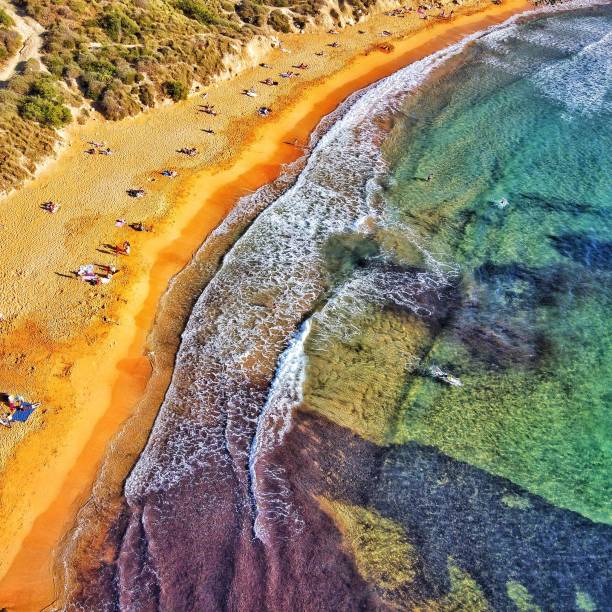 istock Aerial view of people relaxing on sandy beach 1453819624