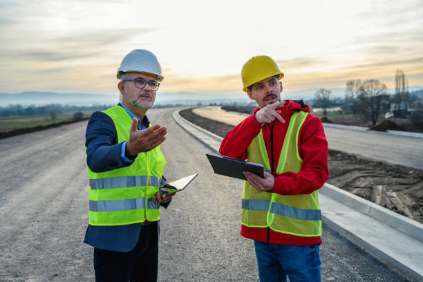istock Engineer and investor on a road construction site 1453819669