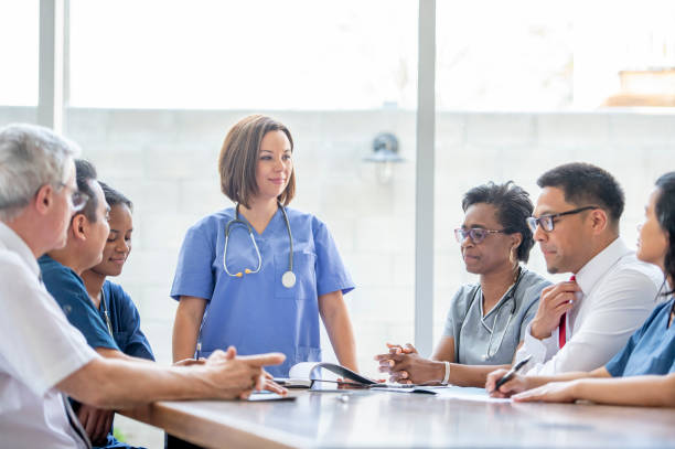 istock Doctor Leading a Team Meeting 1453819686